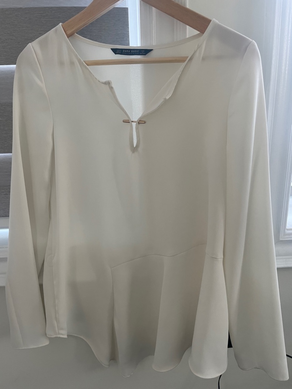 Zara Cream V-Notch Peplum Long-Sleeve Blouse with Gold Bar